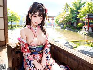 A woman in a kimono walking down a sidewalk.